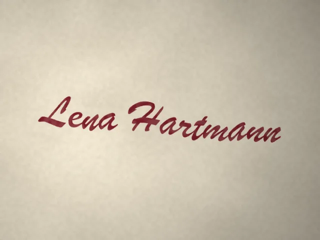 Original photo: Dark red fountain pen on cream paper in window light